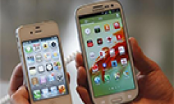 iPhone 4S and Galaxy S III in hand vignette head